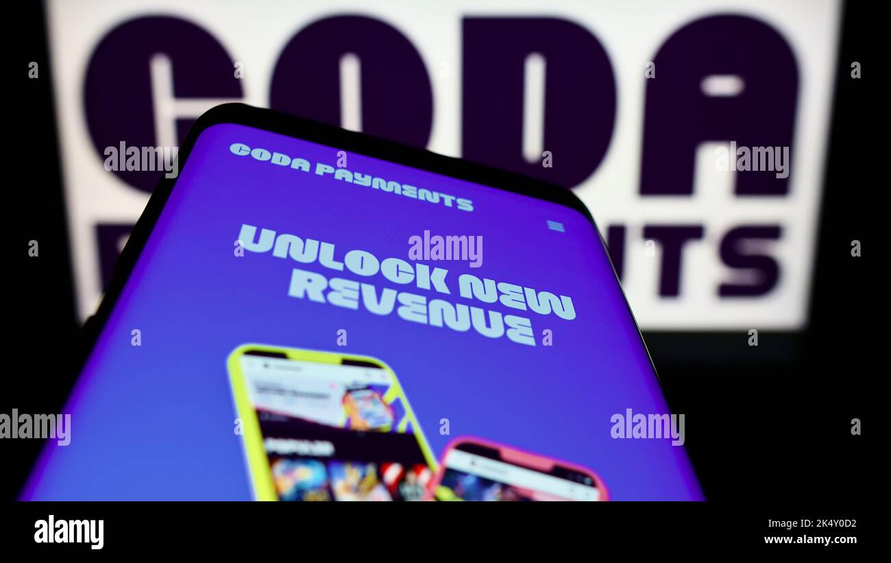 Mobile phone with website of financial company Coda Payments Pte. Ltd ...