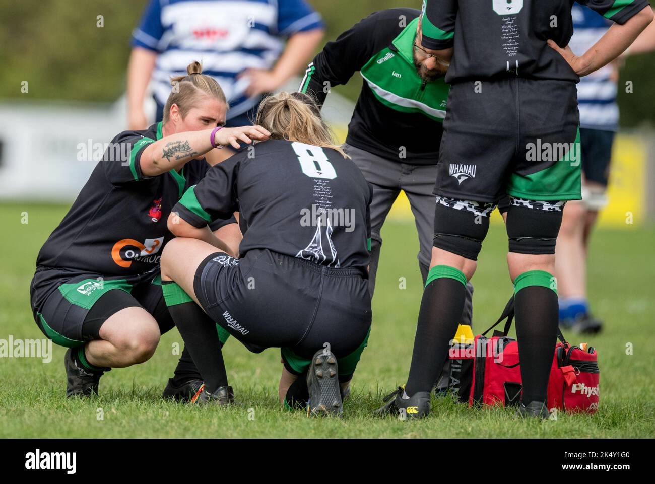 English womens amateur Rugby Union players playing in a league game and recieving medical care. Stock Photo