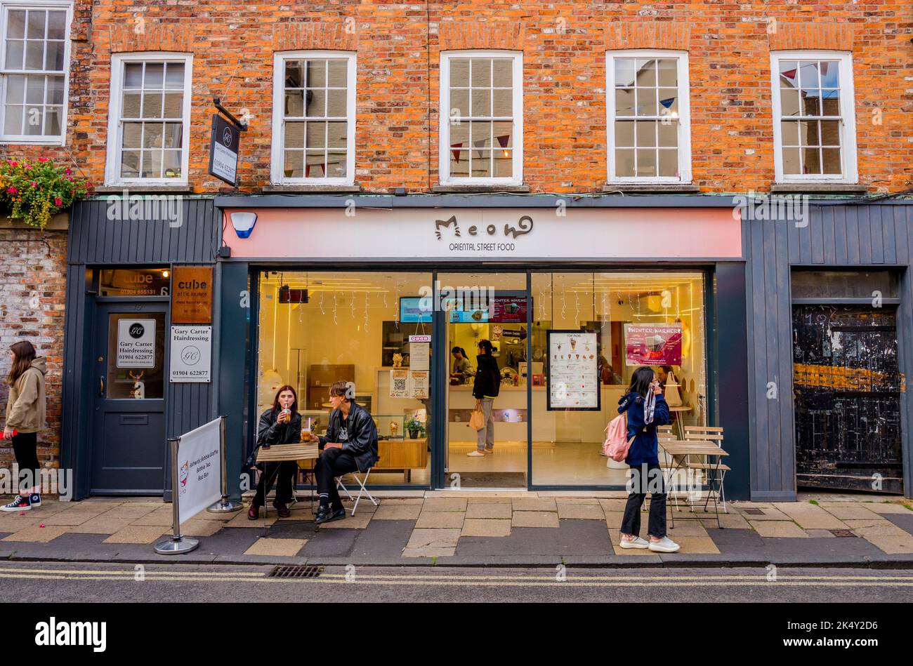 Meow and Bao fast street food restaurant serving oriental street food for sitting and take away customers in the center of York. Stock Photo