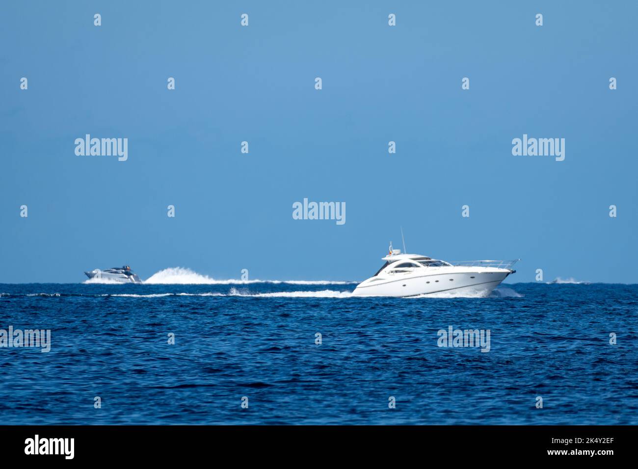 Small white yacht sailing the sea Stock Photo