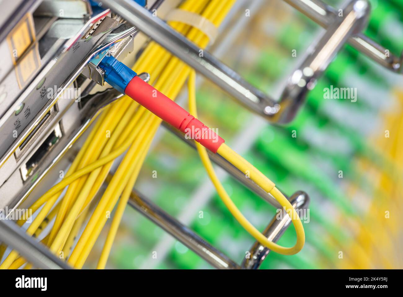Fiber Optical Patch Cord Cable Connected to Optic Port of Switch Stock