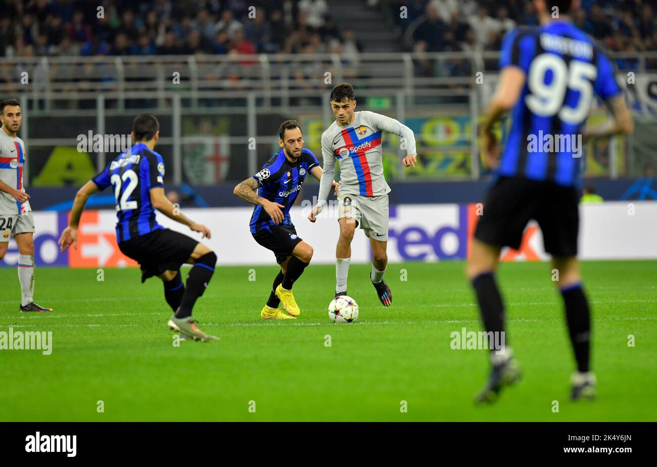 Milano, Italy. 04th Oct, 2022. Pedri (8) of Barcelona and Hakan Calhanoglu (20) of Inter seen during the UEFA Champions League match between Inter and Barcelona at Giuseppe Meazza in Milano. (Photo Credit: Gonzales Photo/Alamy Live News Stock Photo