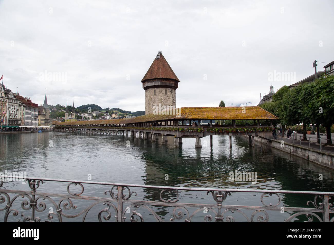 Kapellbrücke (Chapel Bridge) is a covered wooden footbridge spanning the river Reuss in Lucerne and its most famous landmark Stock Photo