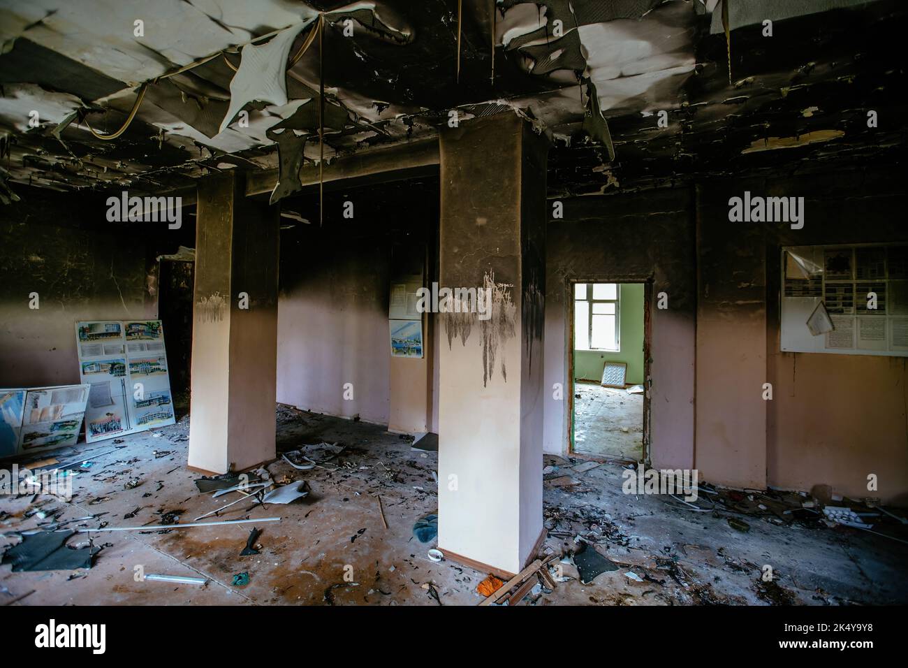 Burnt school interior. Charred walls in black soot. Consequences of