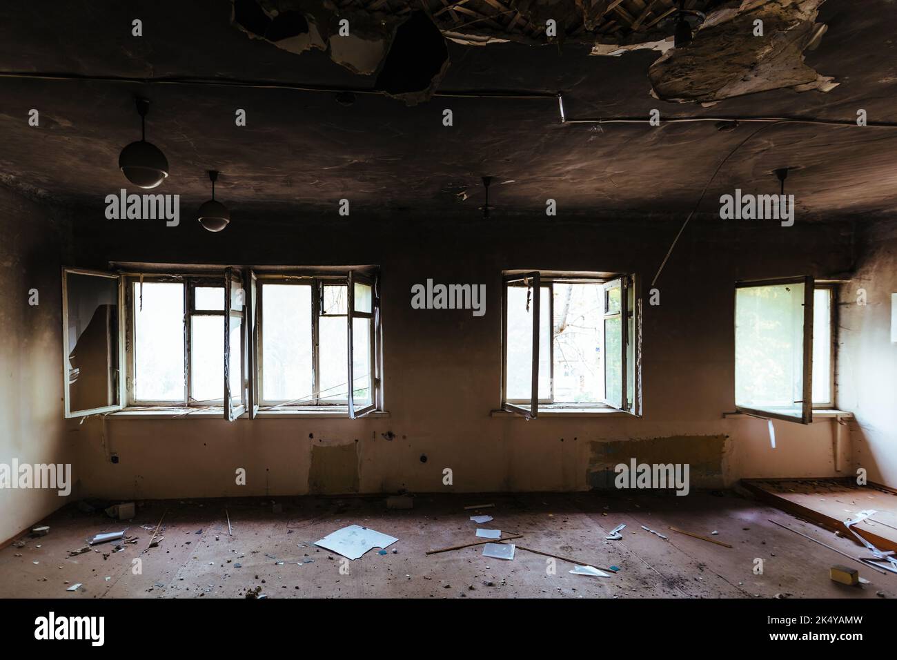 Burnt school interior. Charred walls in black soot. Consequences of