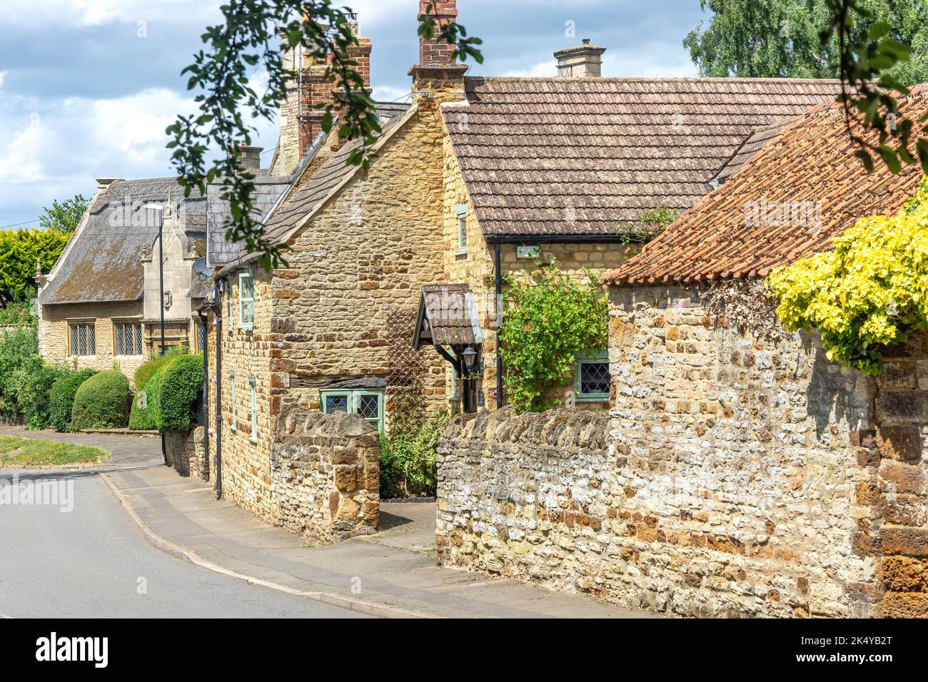 Period stone cottages, Church Street, Burton Latimer, Northamptonshire, England, United Kingdom Stock Photo