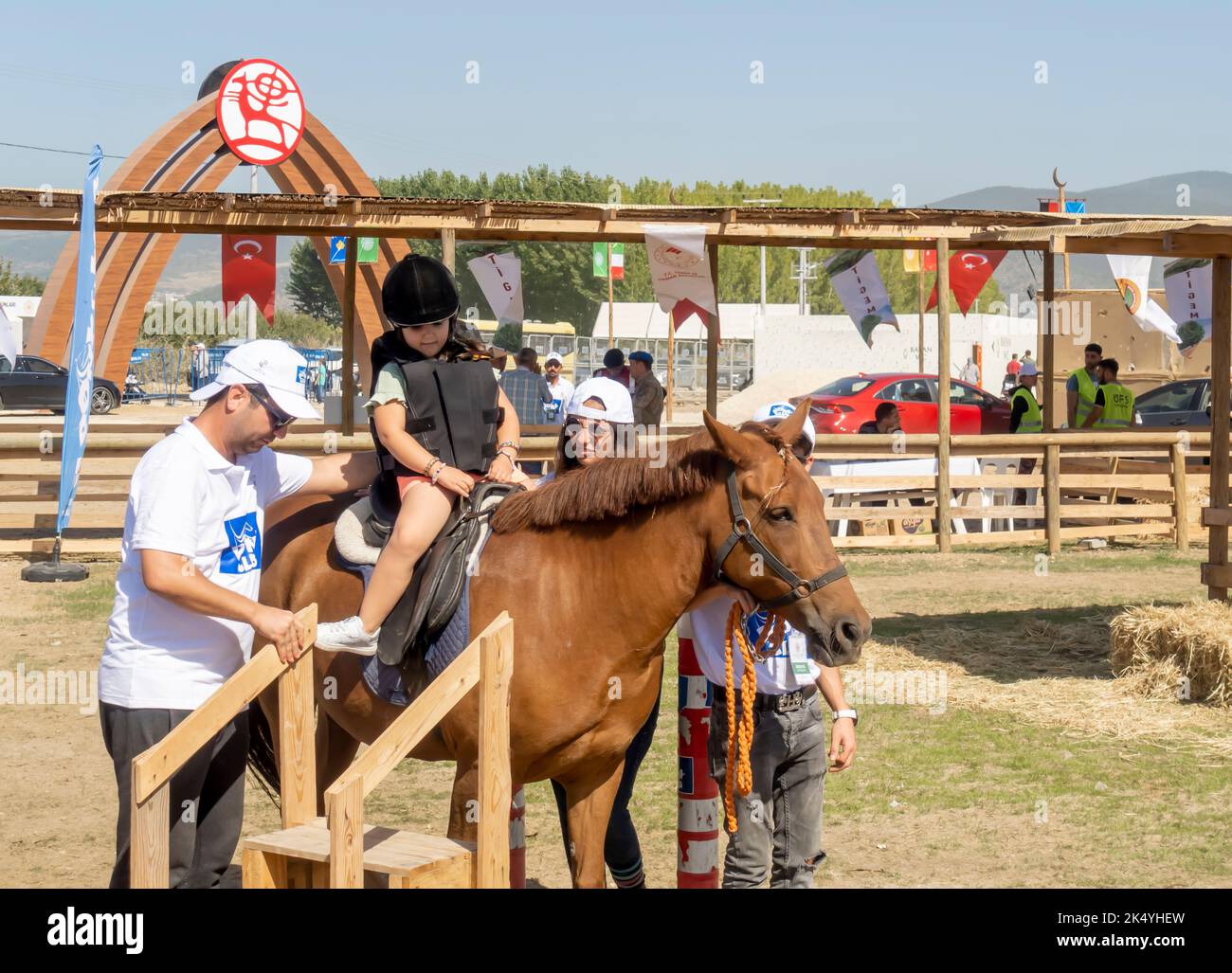 Children learning to ride horse at the playground at Fourth World Nomad ...