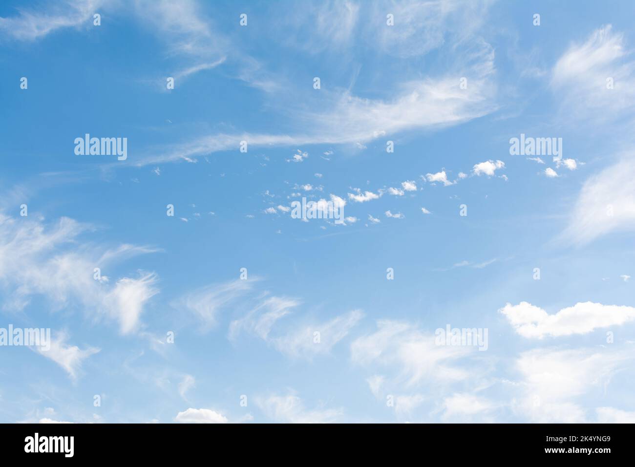 Blue sky with scattered clouds Stock Photo