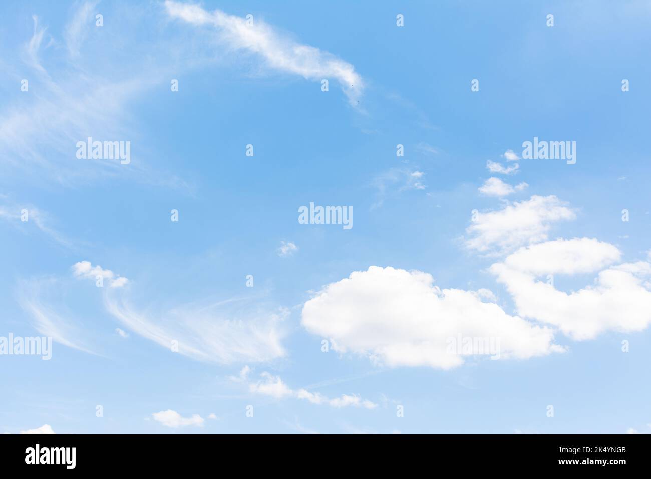 Blue sky with scattered clouds Stock Photo