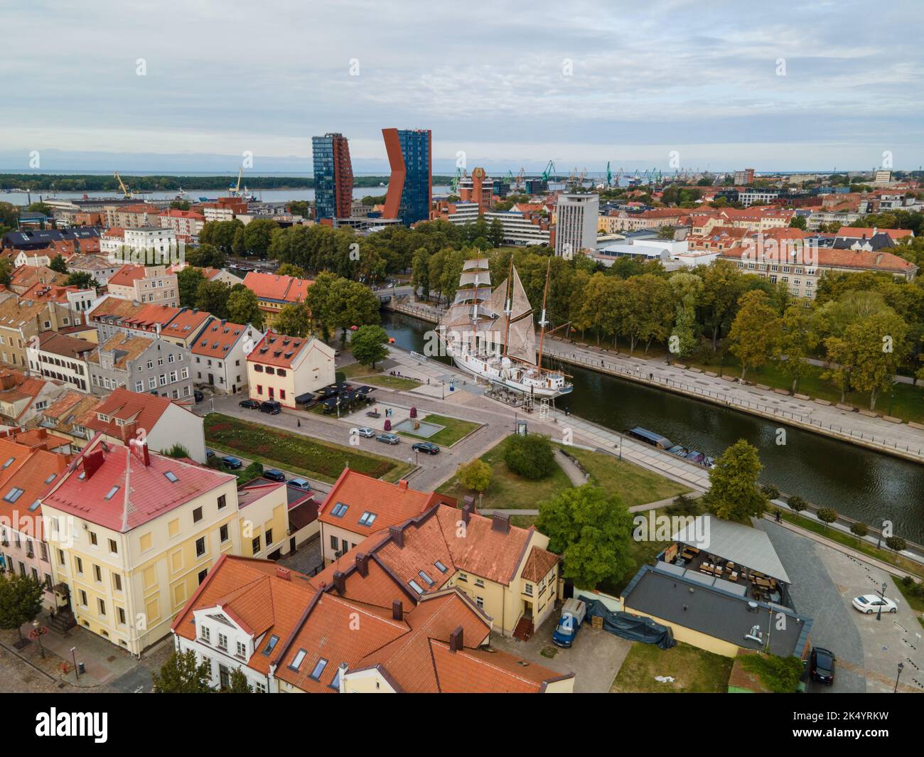 An aerial view of cityscape Klaipeda surrounded by buildings with ...