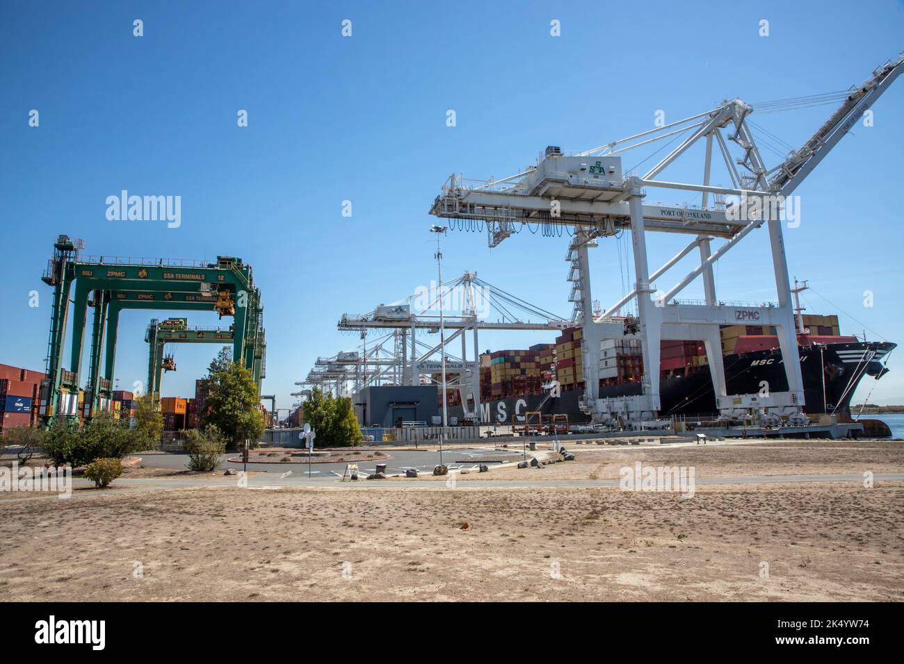 While walking through the Middle Harbor Shoreline Park you can see ships being loaded or unloaded of their containers. Stock Photo