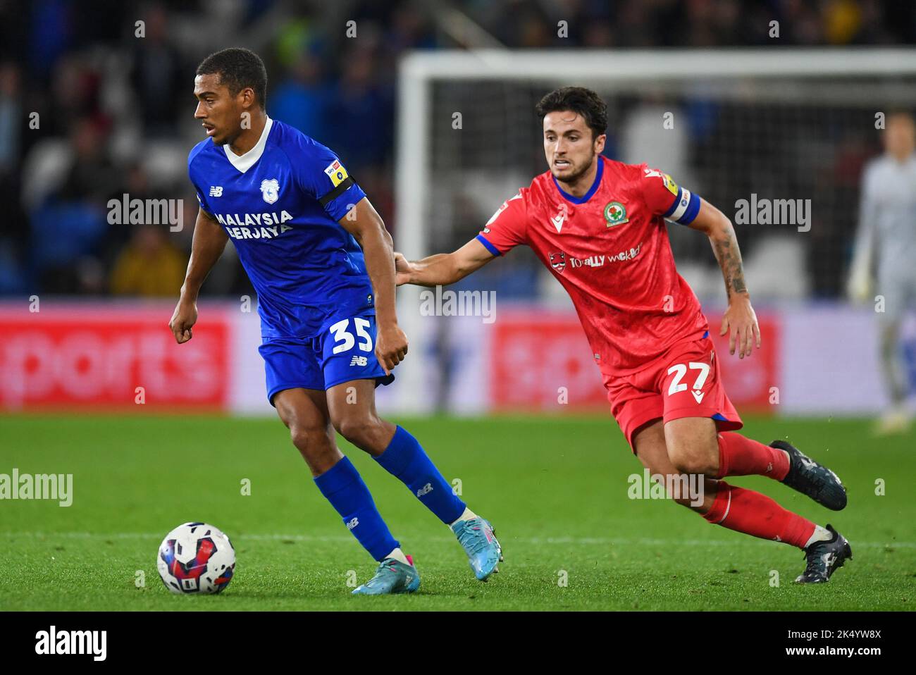 John Buckley #21 of Blackburn Rovers Under pressure fromAndy Rinomhota #35  of Cardiff City during the Sky Bet Championship match Cardiff City vs  Blackburn Rovers at Cardiff City Stadium, Cardiff, United Kingdom