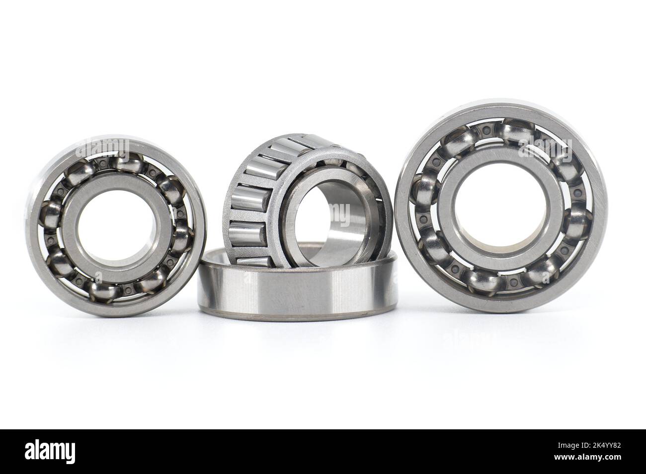 Group of various ball and roller bearings on white background. Spare ...