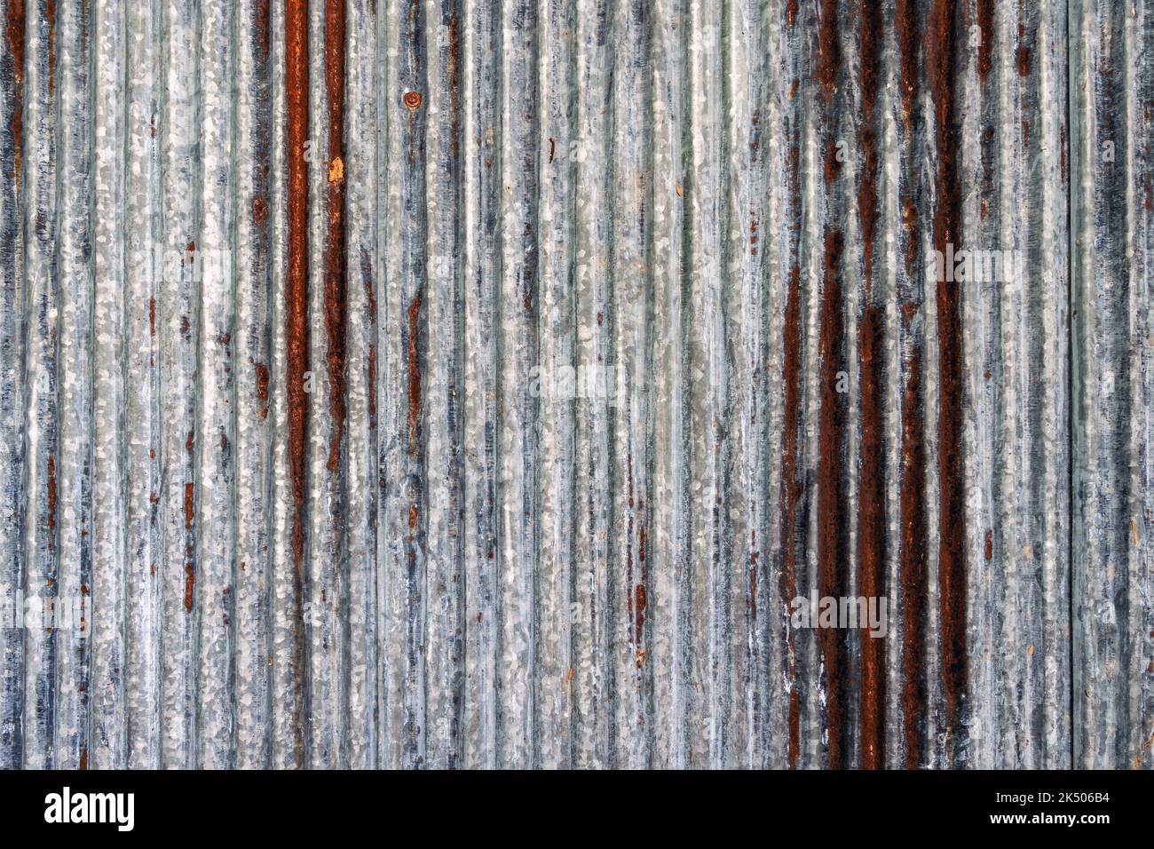 Artistic of old and rusty zinc sheet wall. Vintage style metal sheet
