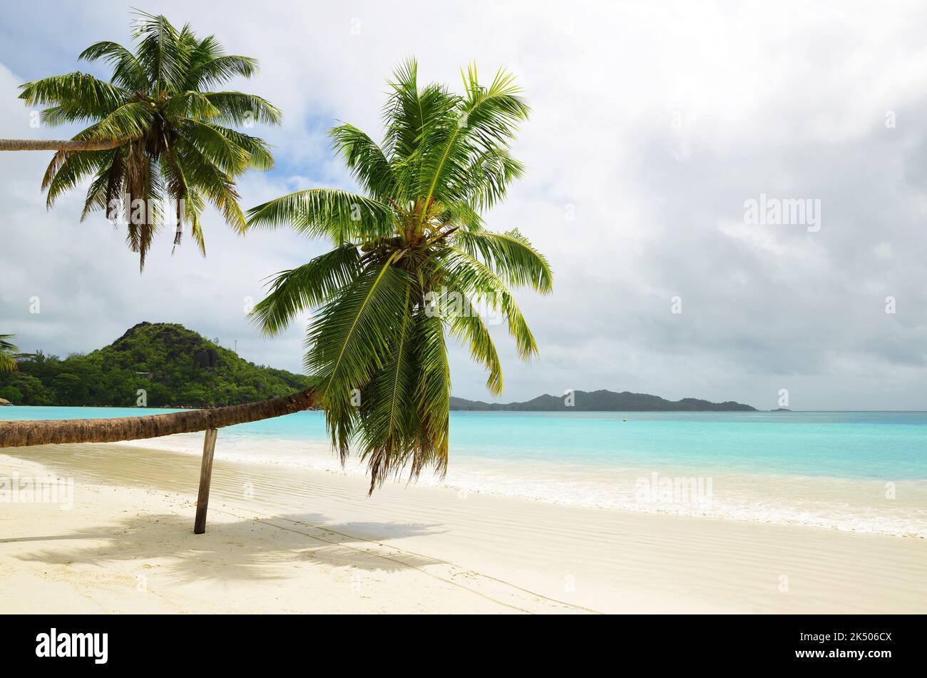 Tropical sand beach Anse Volbert with turquoise sea in the island Praslin, Seychelles, Indian Ocean, Africa. Stock Photo
