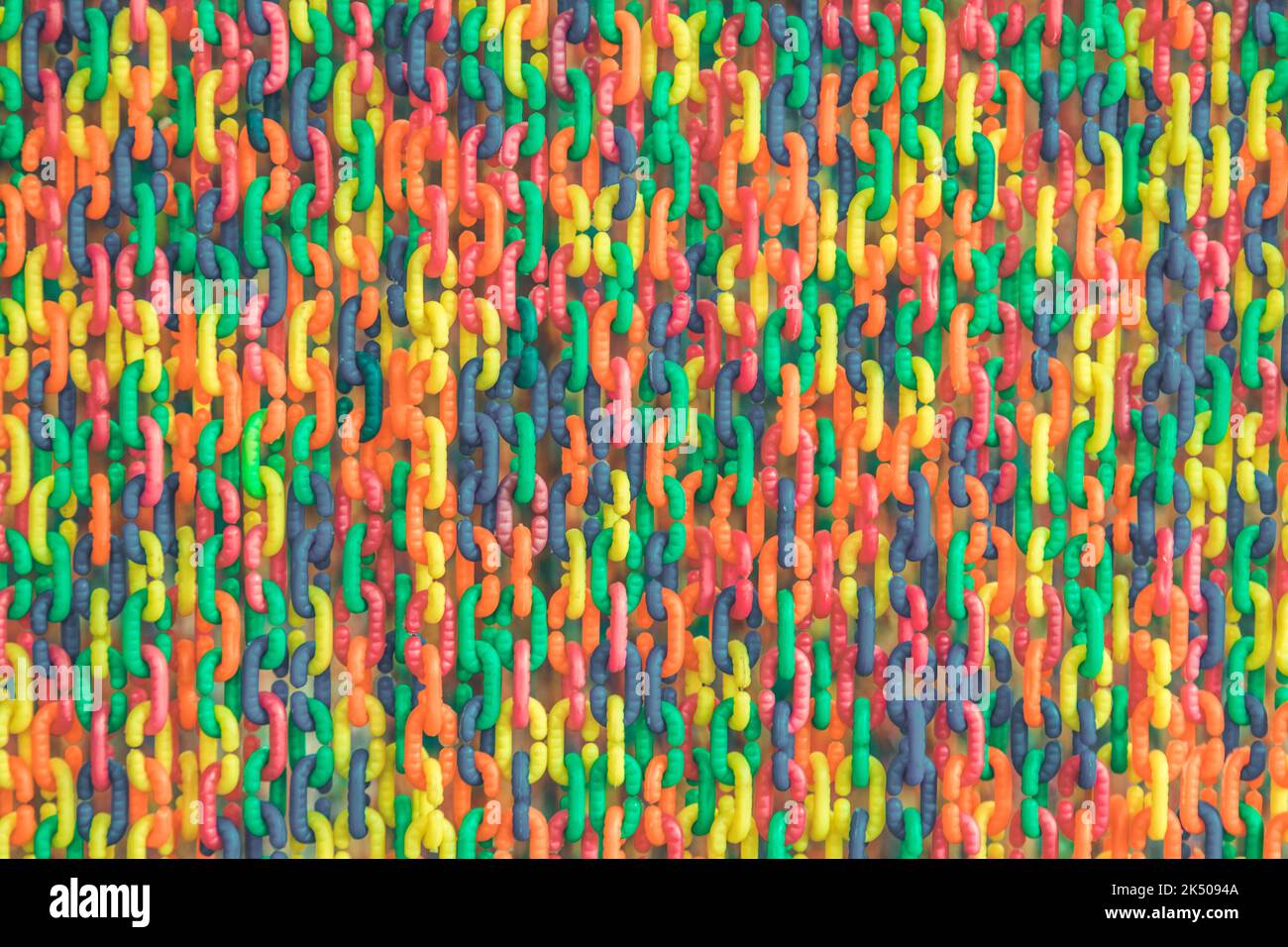 Colorful plastic chain background Stock Photo - Alamy
