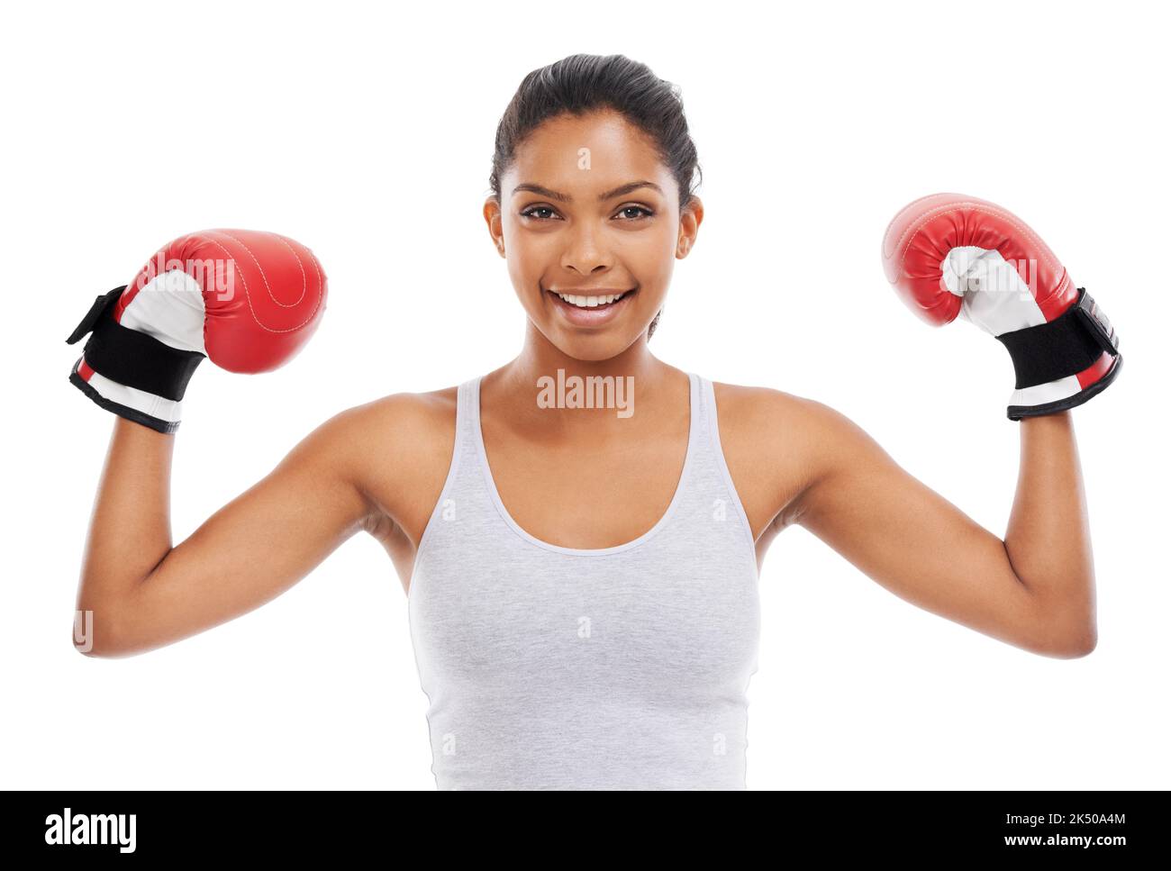Showing off her toned arms. A gorgeous young woman wearing boxing gloves Stock Photo Alamy