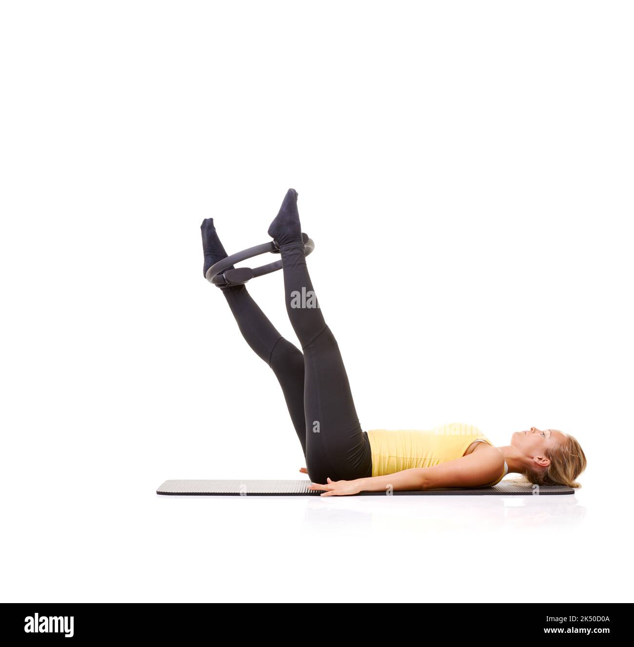 Ringing in her fitness. A pretty young blonde working her legs out with