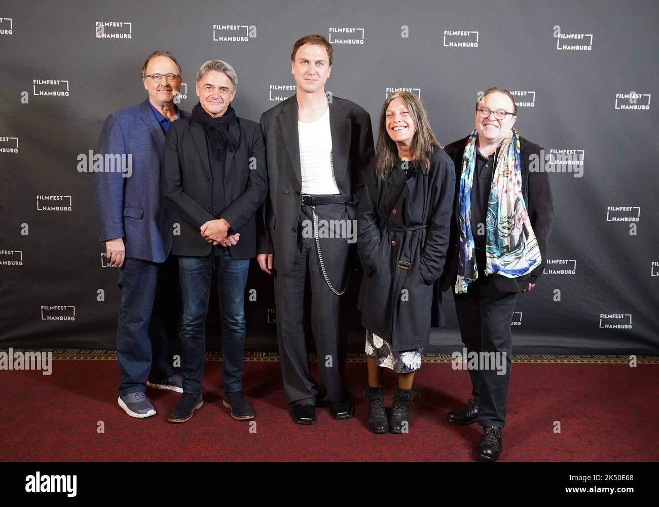 Hamburg, Germany. 04th Oct, 2022. Documentary filmmaker and director Reiner Holzemer (l-r), actor Lars Eidinger, actress Angela Winkler and actor Gustav Peter W·hler arrive at the photo call of the film 'Lars Eidinger - To be or not to be' at the Passage Kino during the 30th Filmfest Hamburg. Credit: Marcus Brandt/dpa/Alamy Live News Stock Photo