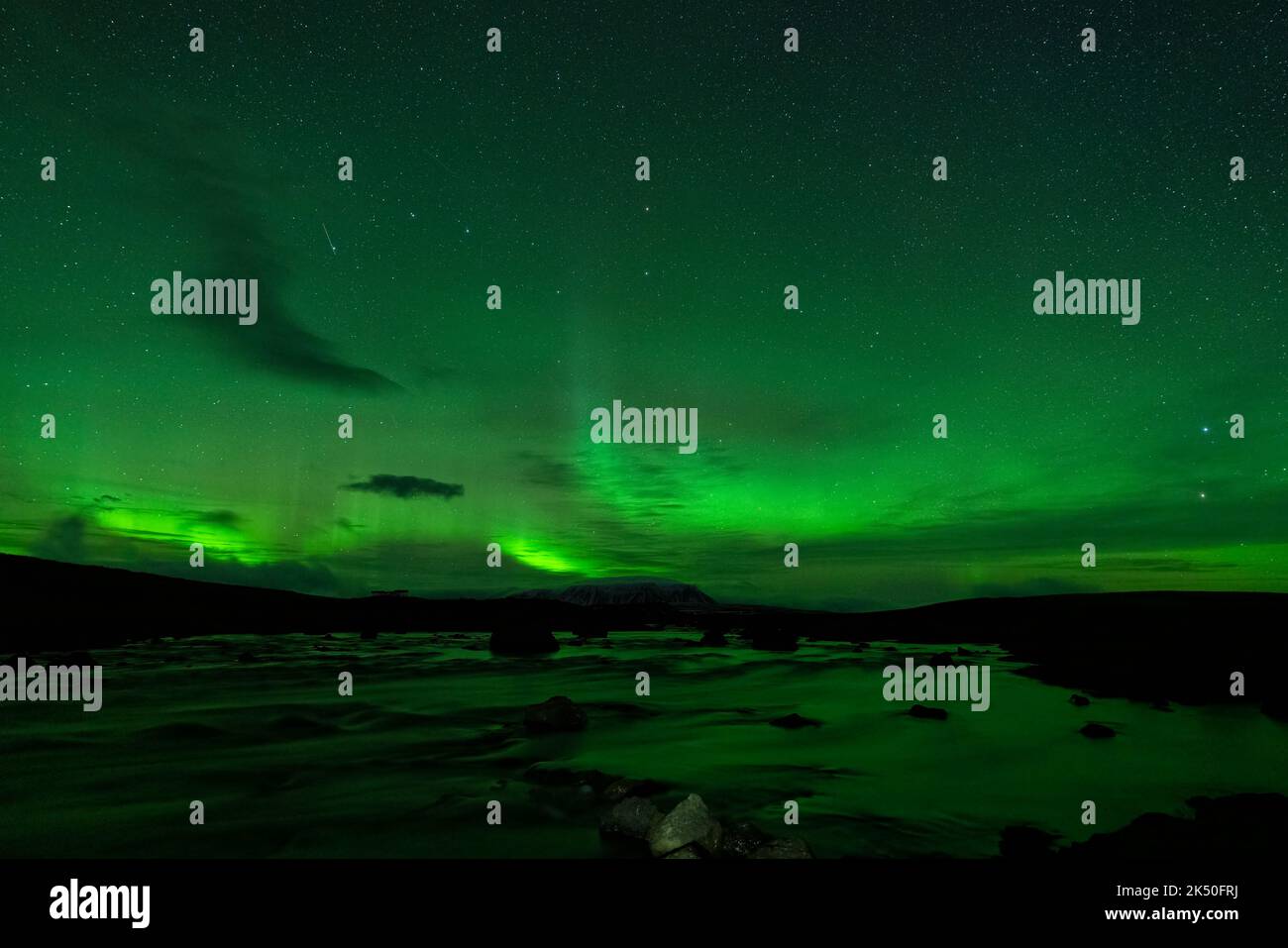 Northern lights over the river silk water Stock Photo