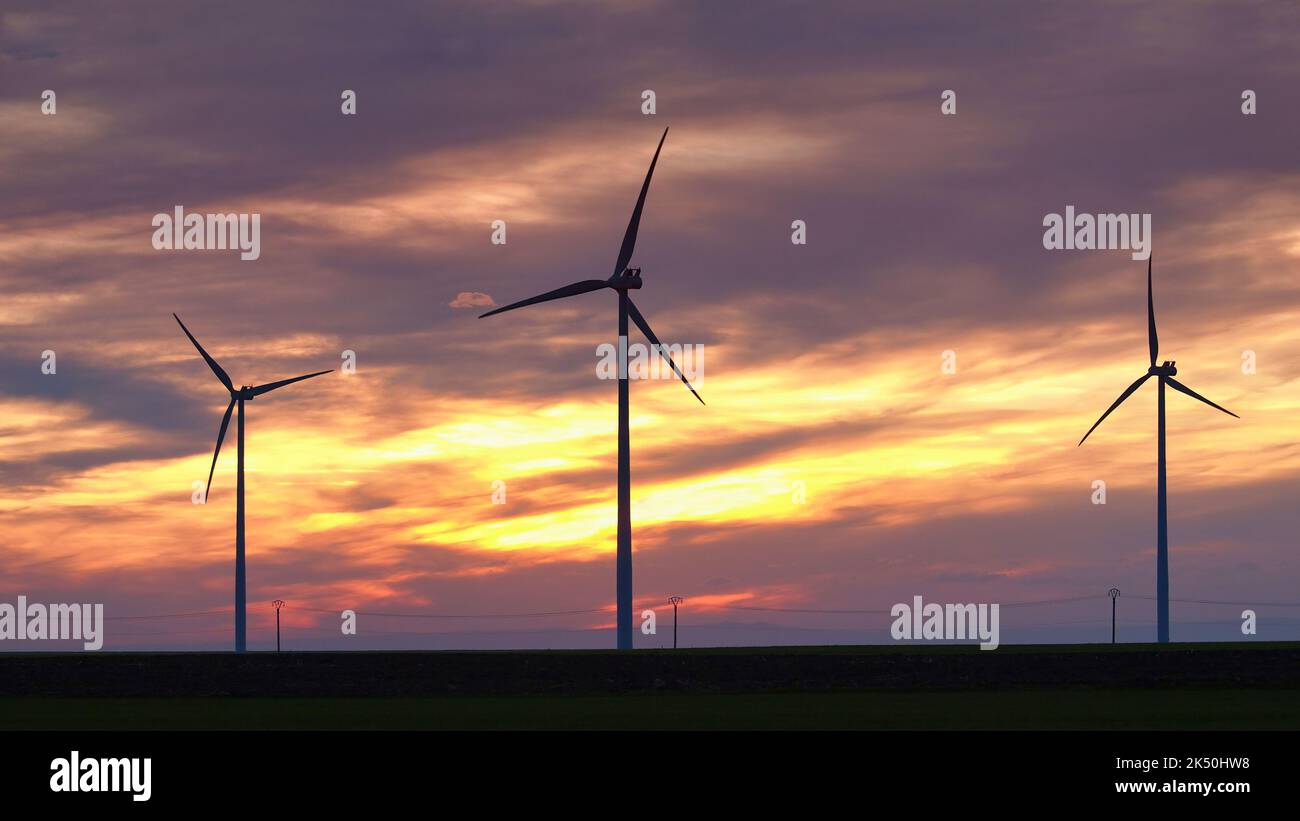 Wind turbine silhouette on beautiful sunset landscape Stock Photo - Alamy