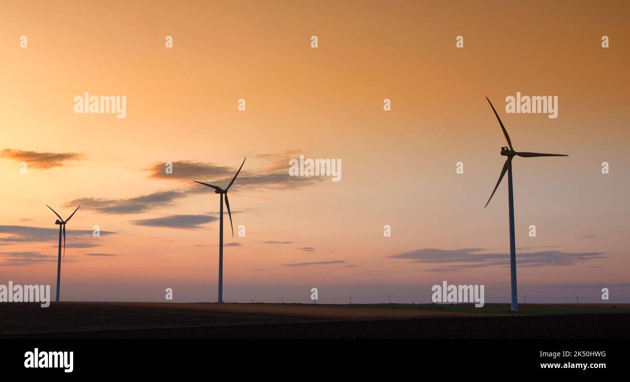 Wind turbine silhouette on beautiful sunset landscape Stock Photo - Alamy