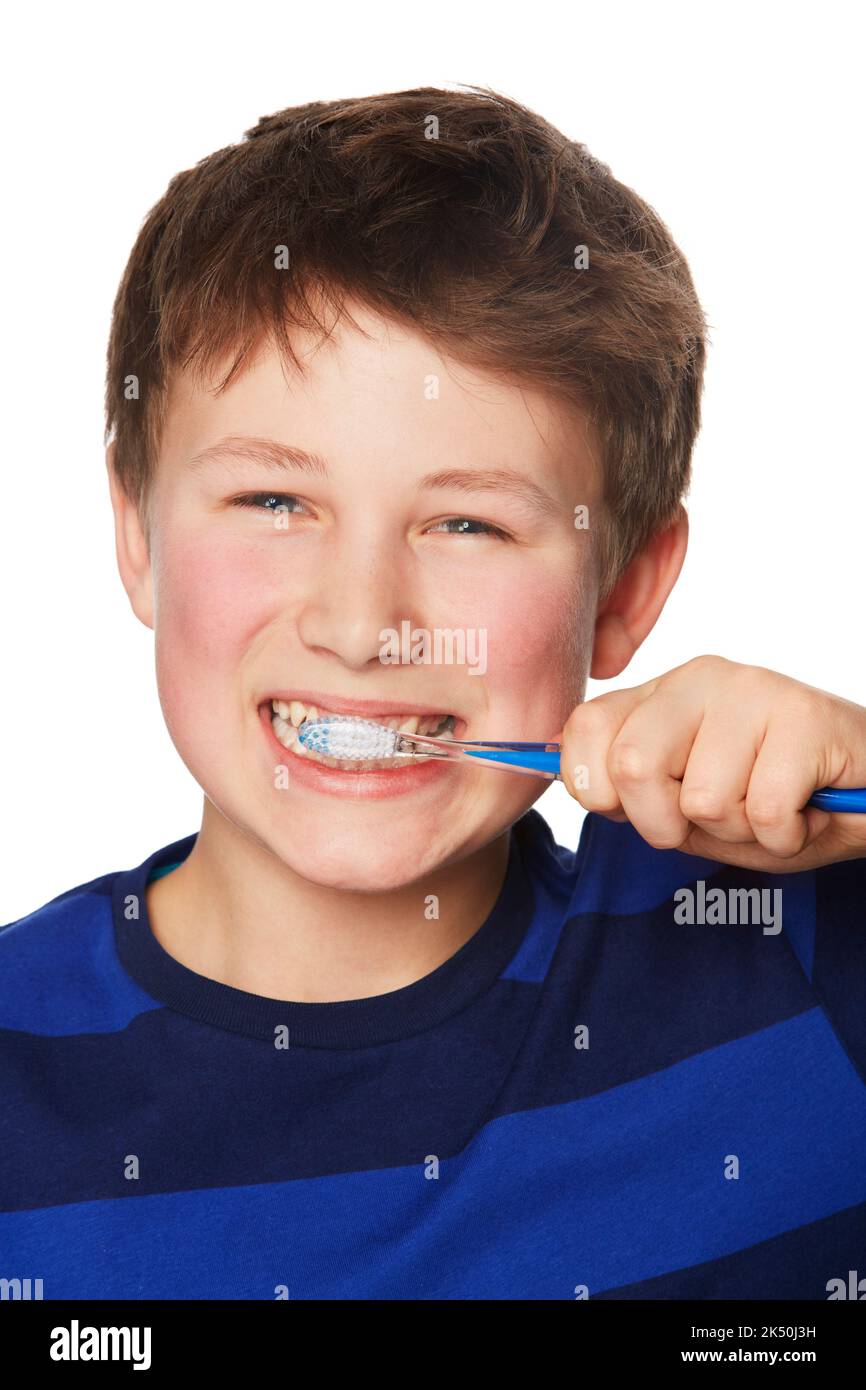 Keeping my teeth healthy. Portrait of a young boy brushing his teeth. Stock Photo
