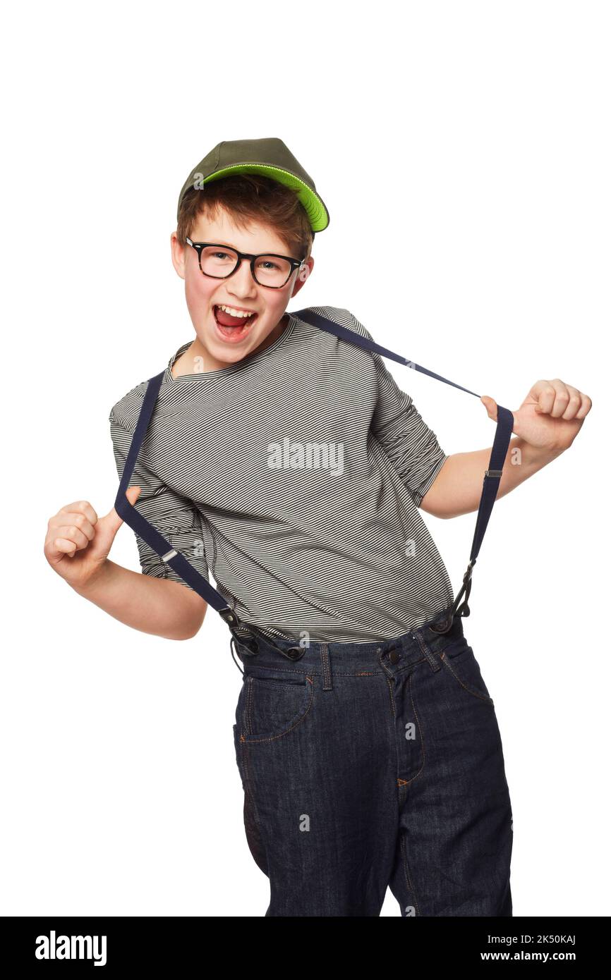 Rocking his suspenders. A teenage boy wearing a hat and glasses while pulling his suspenders. Stock Photo