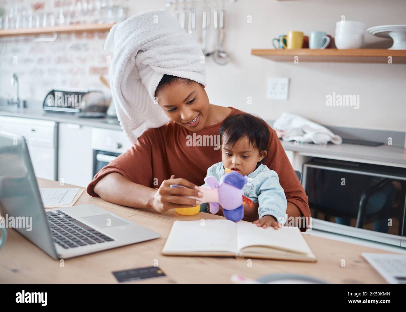 Multitasking Mom Mom multitasking in kitchen hi-res stock photography and images - Alamy
