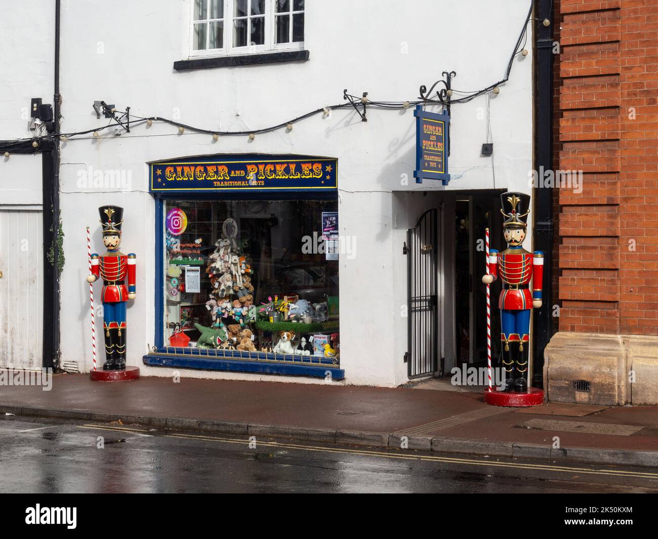 Ginger and Pickles traditional toy shop in the town of Upton Upon Severn, Worcestershire, UK;  flanked by two Nutcracker figures Stock Photo