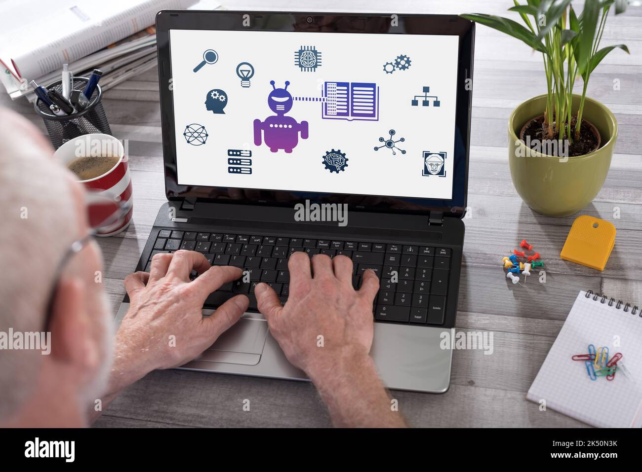 Machine learning concept shown on a laptop used by a man Stock Photo