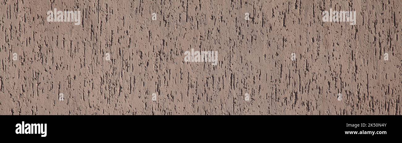Brown texture, background. Decorated surface with vertical embossed pattern. Backdrop and surface with chaotic, abstract pattern Stock Photo