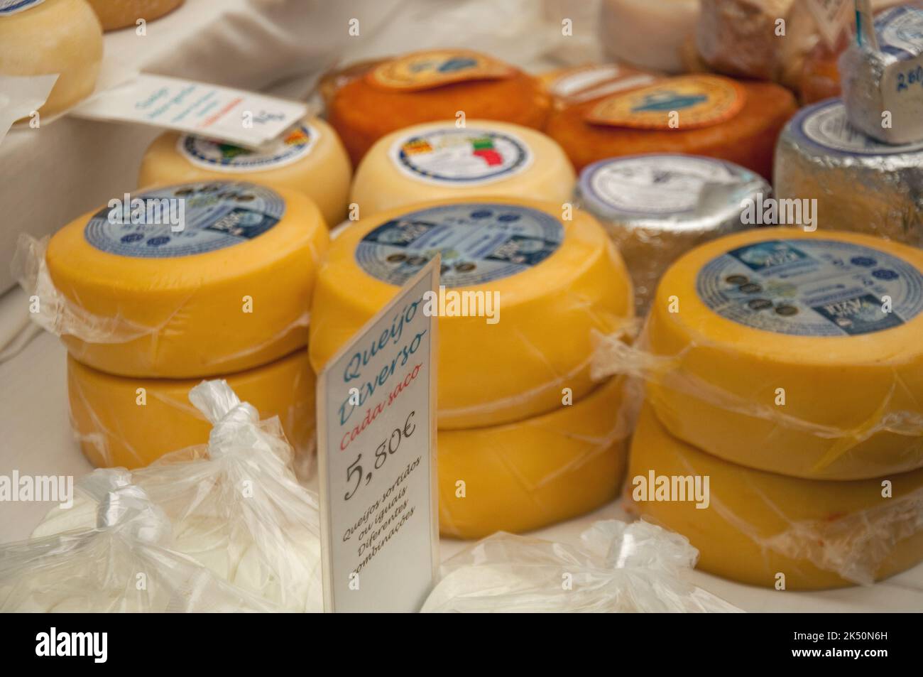 Cascais Municipal Market, Cascais, Portugal - various cheeses wrapped in plastic Stock Photo