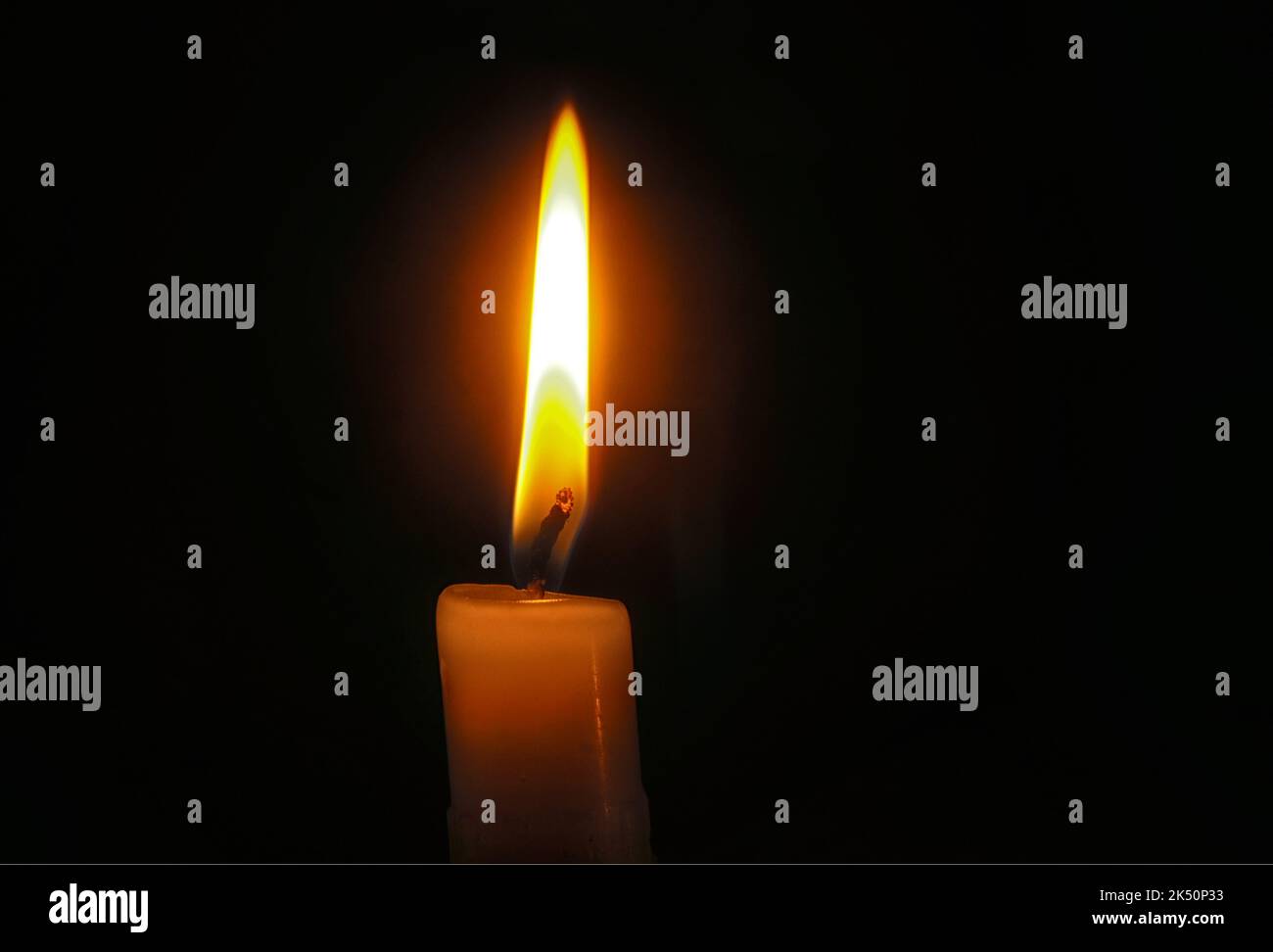 Close up of Candle Flame in the dark. Stock Photo