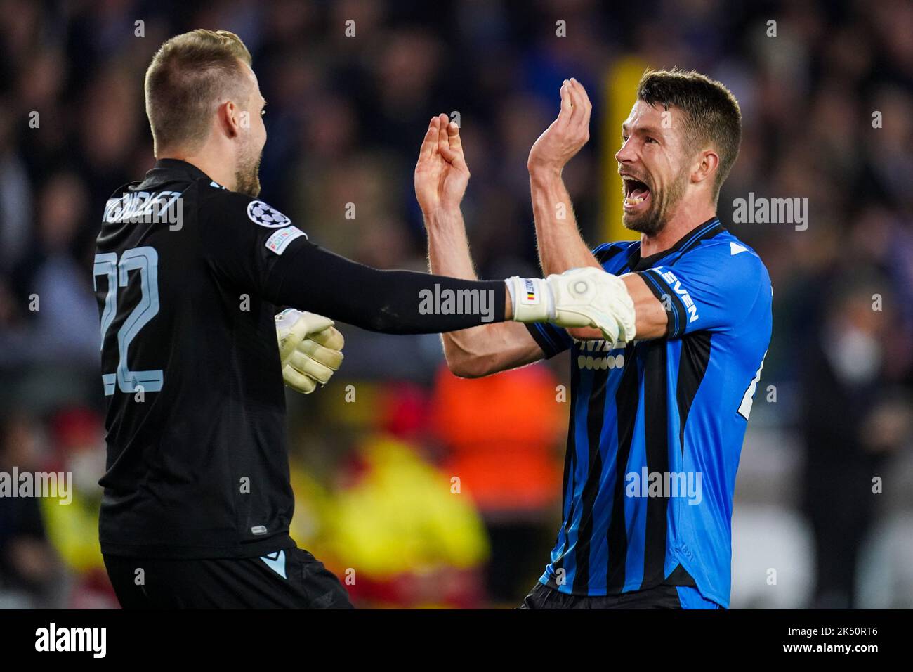 BRUGGES, BELGIUM - OCTOBER 4: Simon Mignolet of Club Brugge KV and Brandon Mechele of Club Brugge KV celebrating their sides win after the Group B - UEFA Champions League match between Club Brugge KV and Atletico Madrid at the Jan Breydelstadion on October 4, 2022 in Brugges, Belgium (Photo by Joris Verwijst/Orange Pictures) Stock Photo