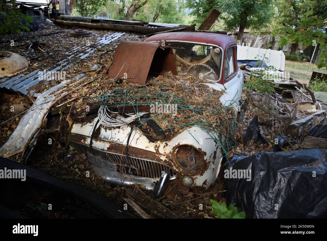 Rusty Old Car Wreck or Derelict Car Simca Aronde P60 Chatelaine Estate Car in Abandoned Farm Yard Stock Photo