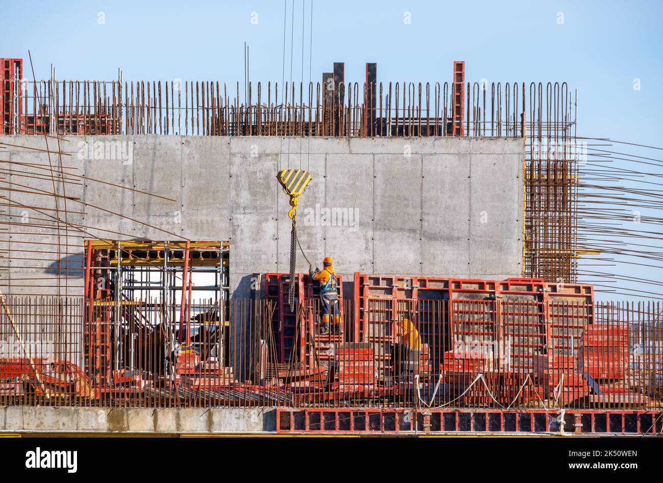 Anonymous engineer working at construction site on sunny day Stock Photo
