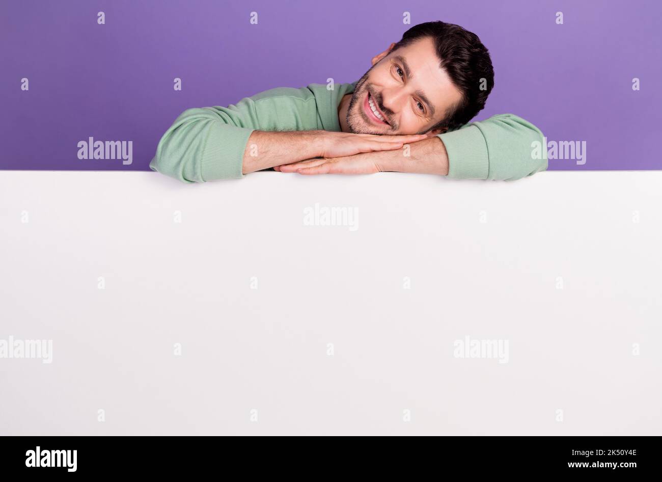 Photo portrait of handsome young man laying empty space toothy smile ...
