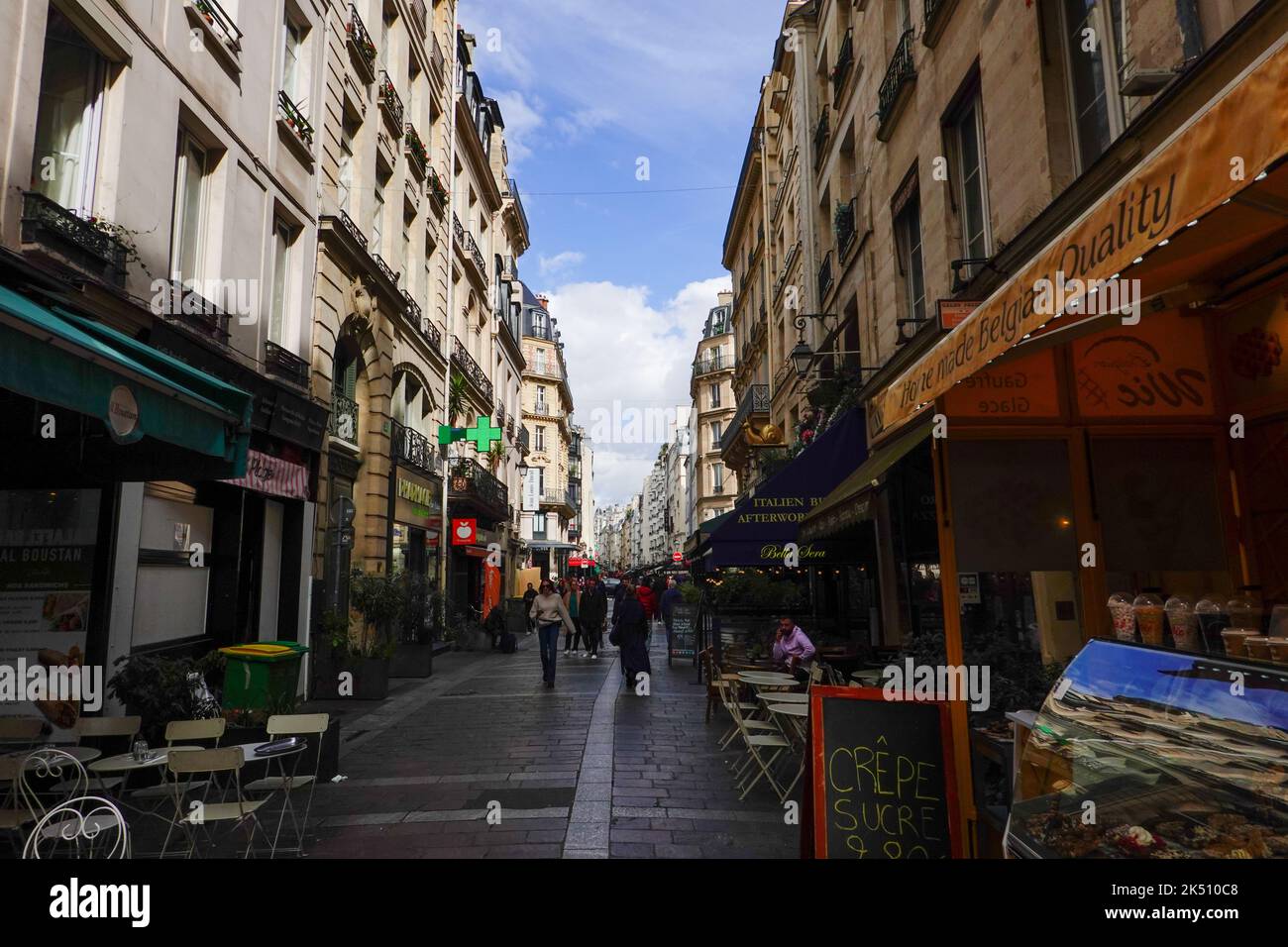 Busy rue Montorgueil shopping and eating district, with people, in the 2nd Arrondissement, Paris, France. Stock Photo