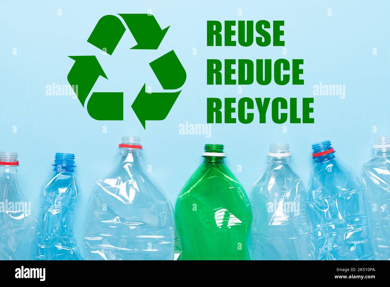 Recycling symbol with recycle reduce reuse words and emply plastic