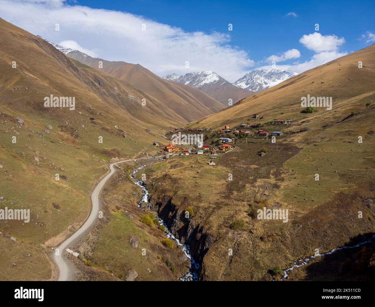 Village amidst mountains in daytime Stock Photo - Alamy