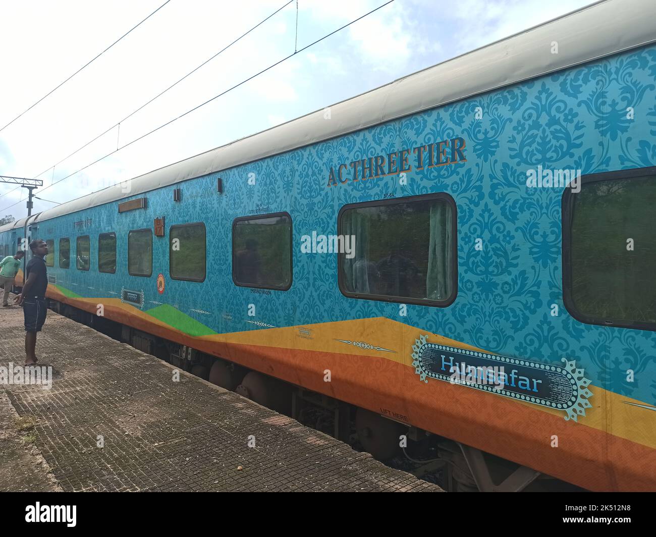 Humsafar Express standing at a platform. it is a fully premium service