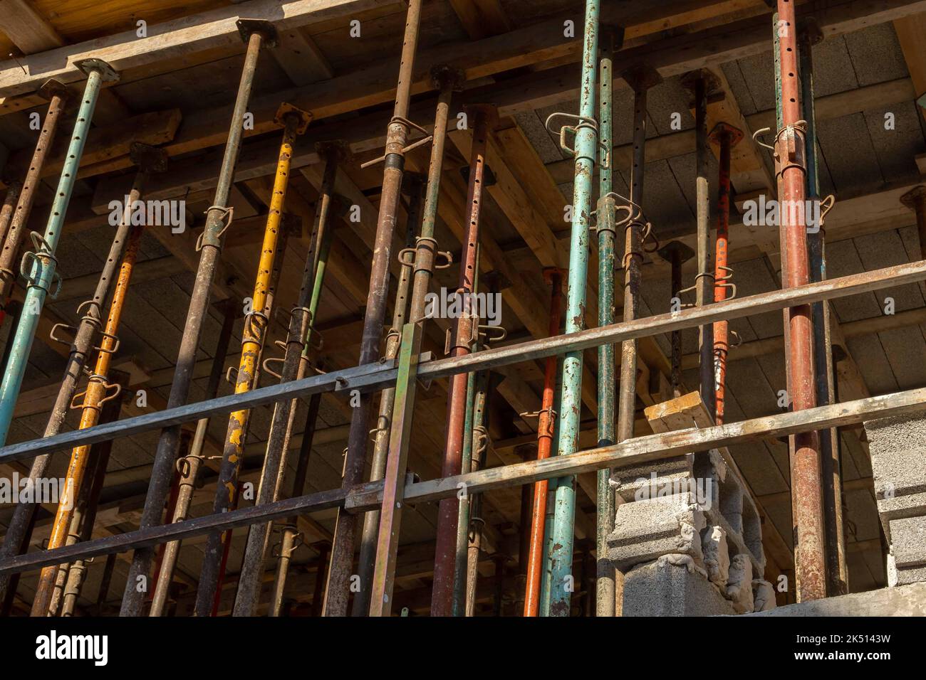 Structure of a house in the process of renovation, full of metal struts. Conceptual image of