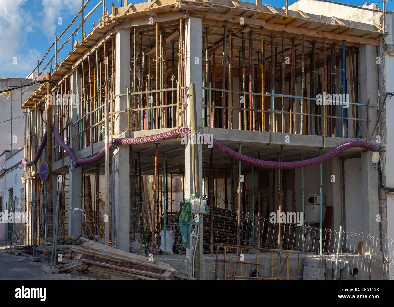 Structure of a house in the process of renovation, full of metal struts. Conceptual image of
