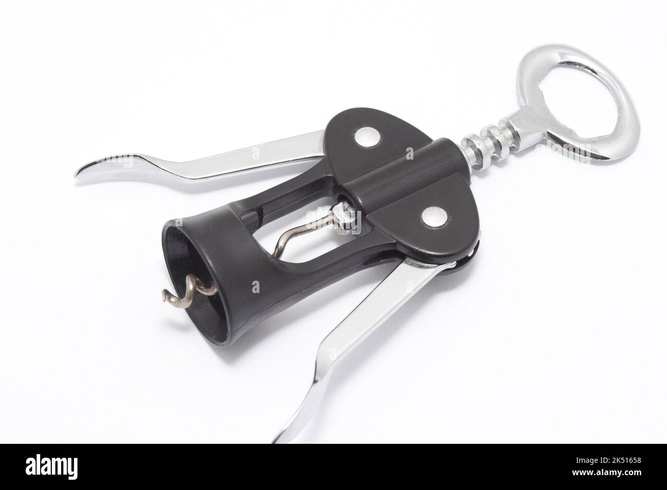 Wine bottle opener with lever mechanism and steel corkscrew lying