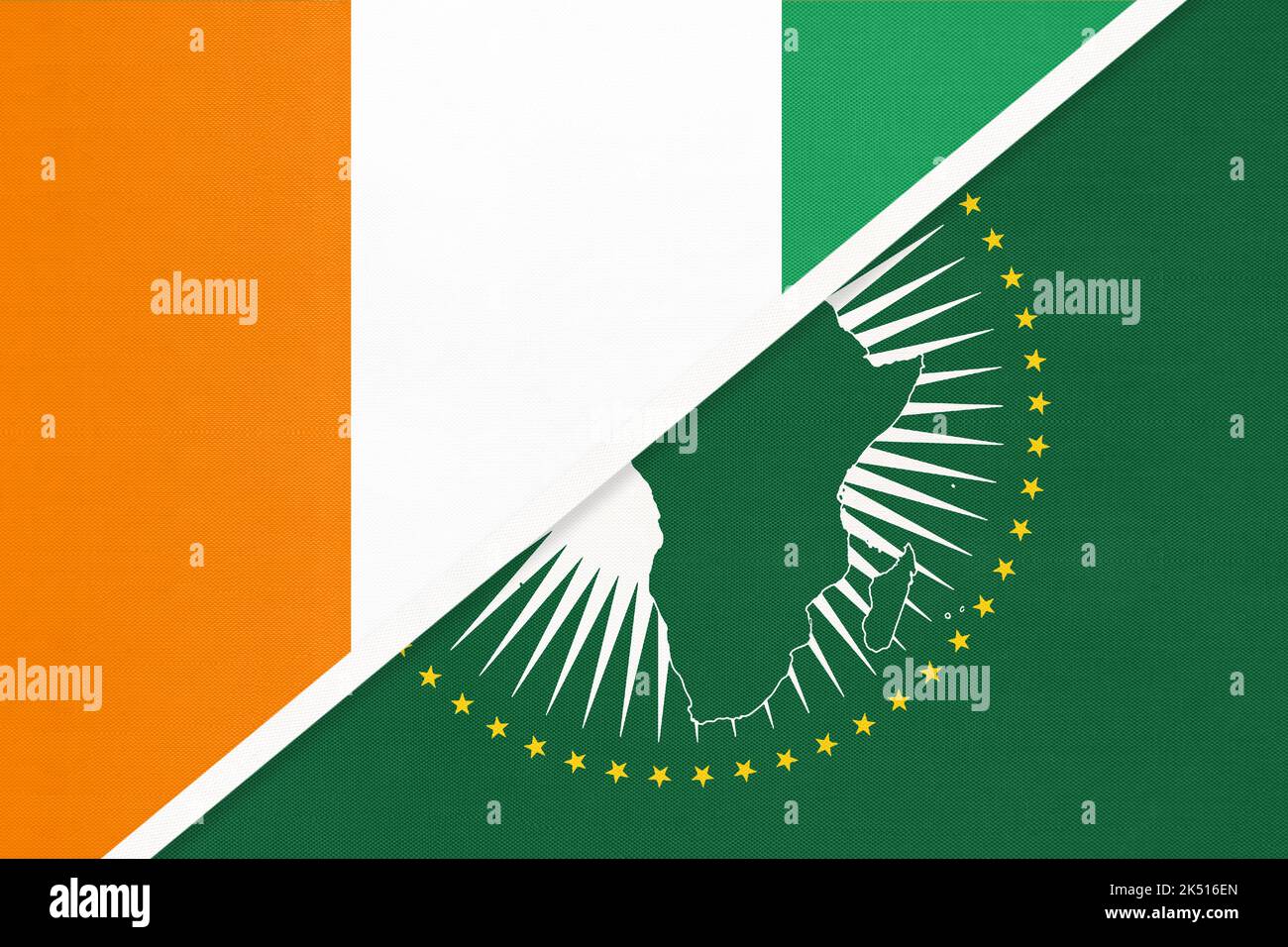 African Union and Ivory Coast national flag from textile. Africa continent vs Ivorian symbol. Stock Photo