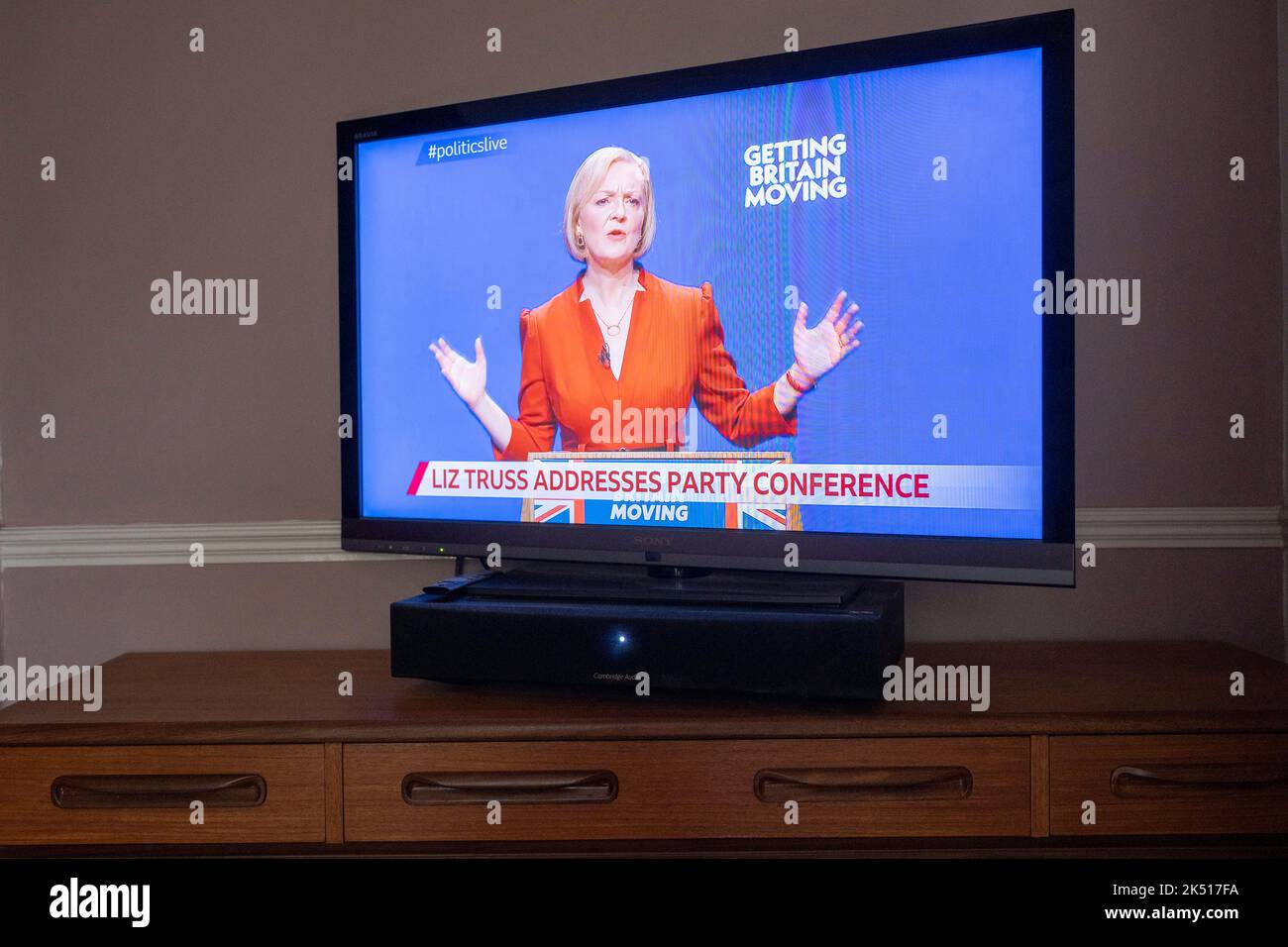 UK Prime Minister Liz Truss gives her speech live on a TV screen from the BBC's live broadcast in a south London home, on the final day of the Conservative Party conference in Birmingham, on 5th October 2022, in London, England. Stock Photo