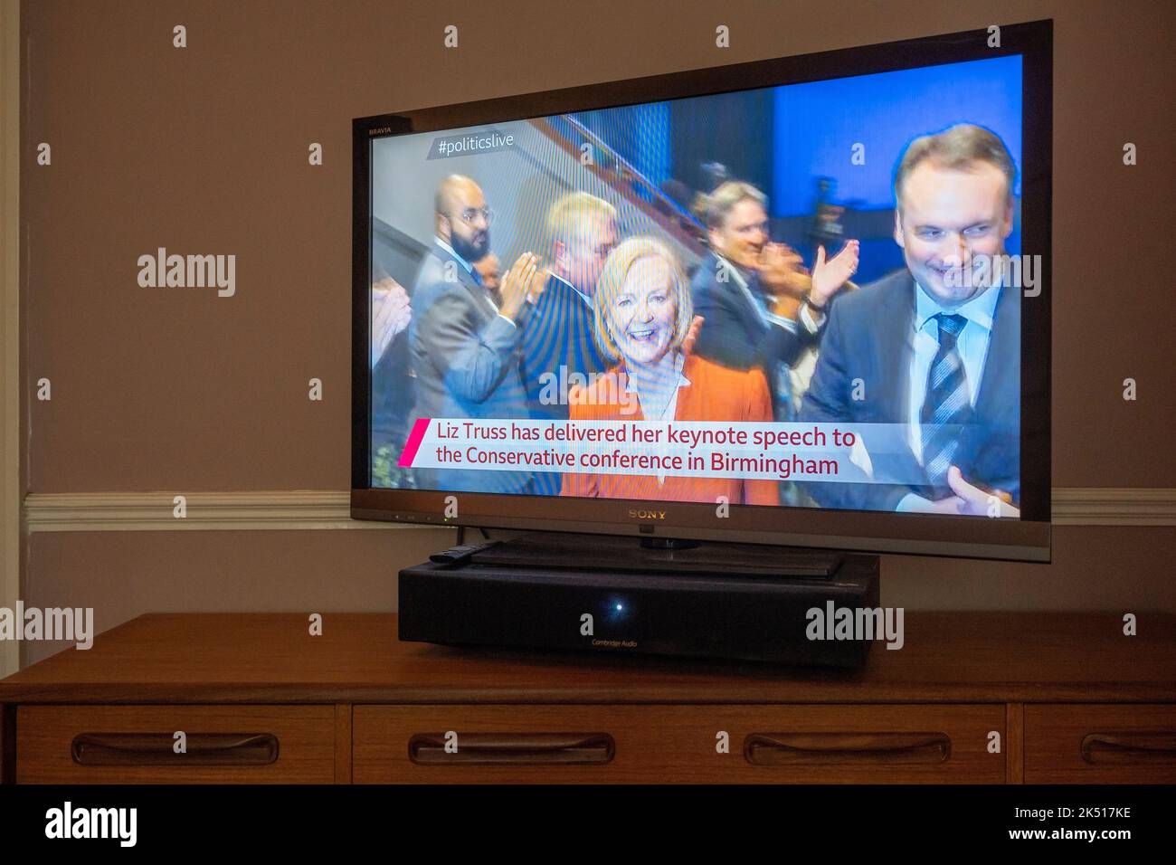UK Prime Minister Liz Truss and husband Hugh O'Leary (right) are seen leaving the hall after her live speech live on a TV screen from the BBC's live broadcast, on the final day of the Conservative Party conference in Birmingham, on 5th October 2022, in London, England. Stock Photo