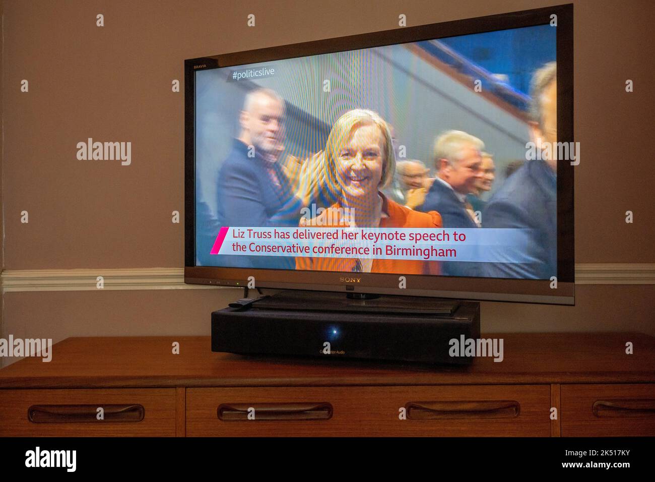 UK Prime Minister Liz Truss is seen leaving the hall after her live speech live on a TV screen from the BBC's live broadcast, on the final day of the Conservative Party conference in Birmingham, on 5th October 2022, in London, England. Stock Photo