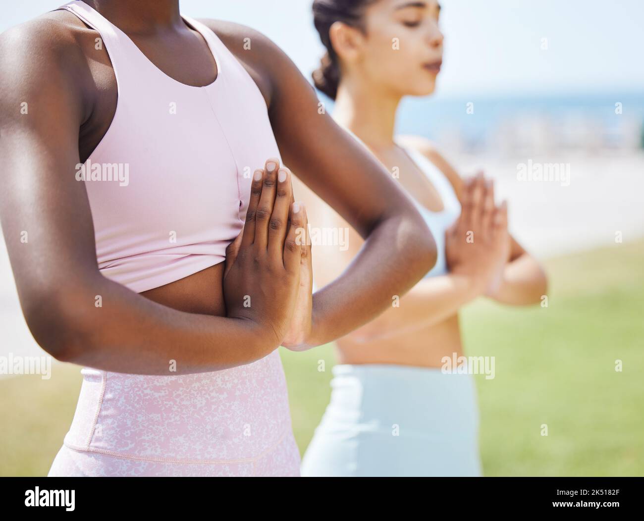 Meditation women, nature and namaste hands praying zen energy, peace or spiritual training, workout and outdoor exercise. Calm, relax and yoga fitness Stock Photo